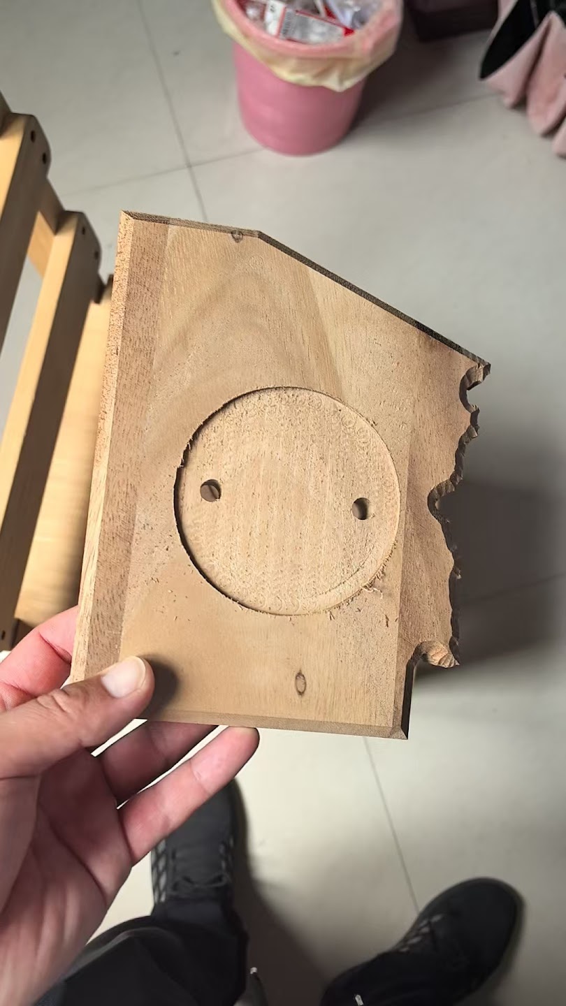 Workshop photograph of a shaped wood component before final assembly.