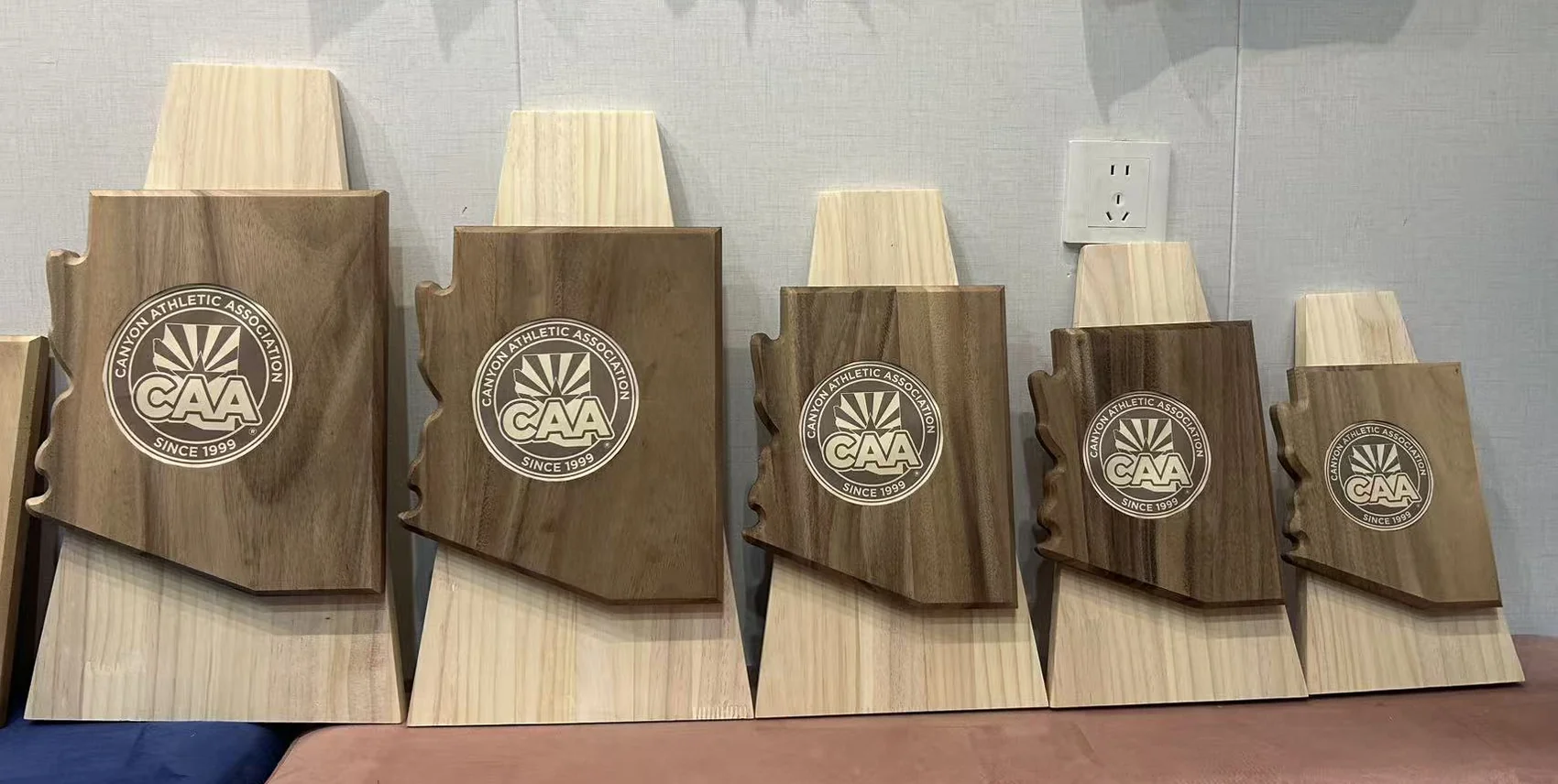 CAA custom wood trophy series in five coordinated award sizes