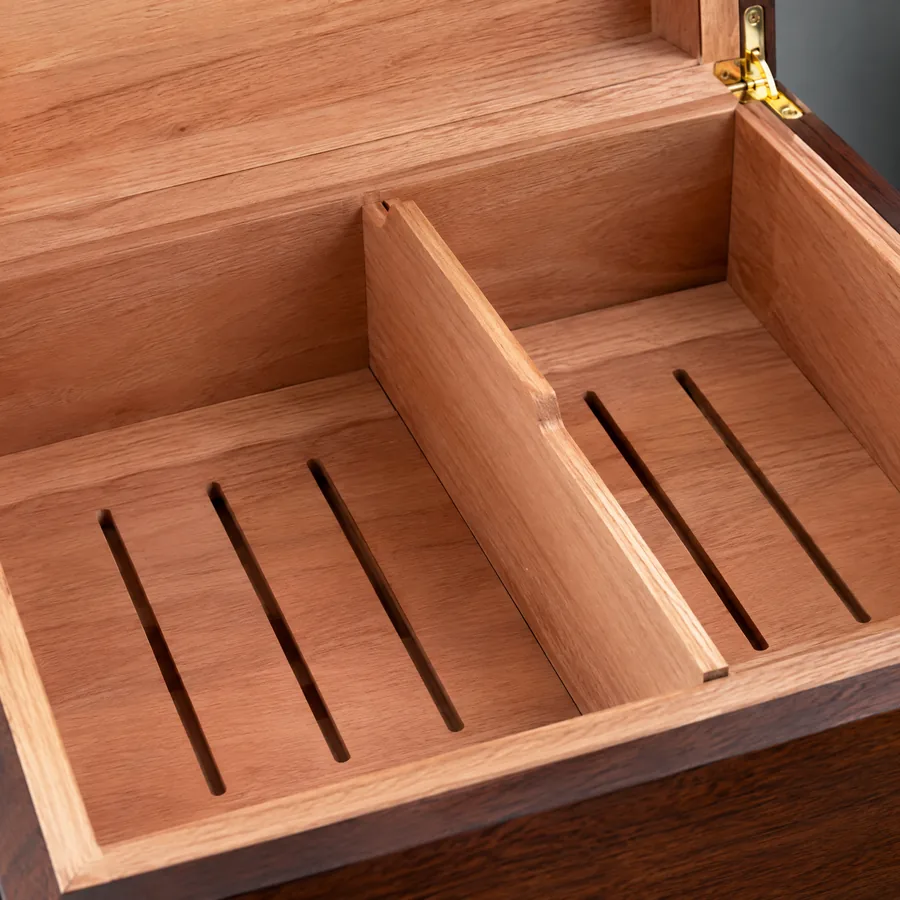Unbranded cedar divider detail inside a wood cigar storage case