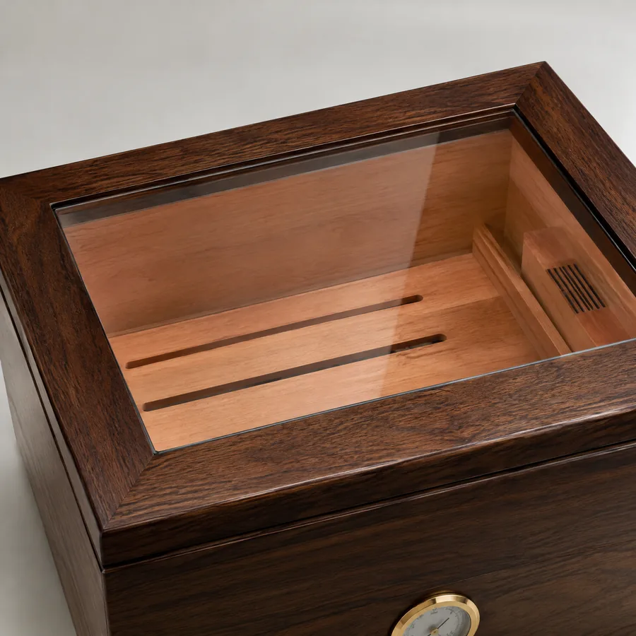Unbranded framed glass viewing lid on a wood cigar humidor