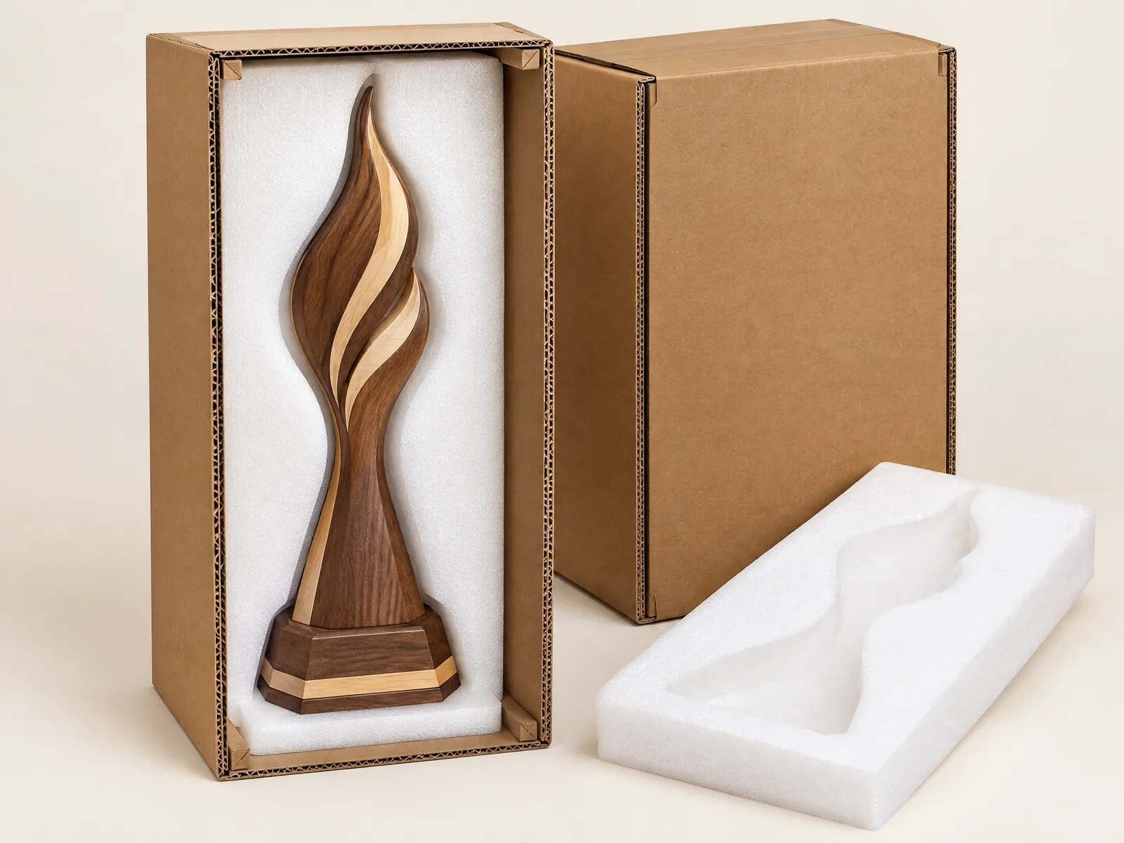 Flame trophy protected by a custom-cut EPE foam cavity inside a heavy corrugated shipping carton