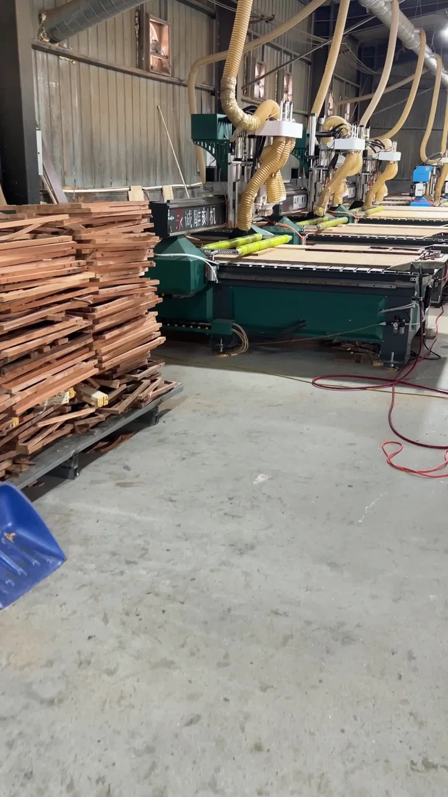 Wood stock and CNC machines in the factory workshop