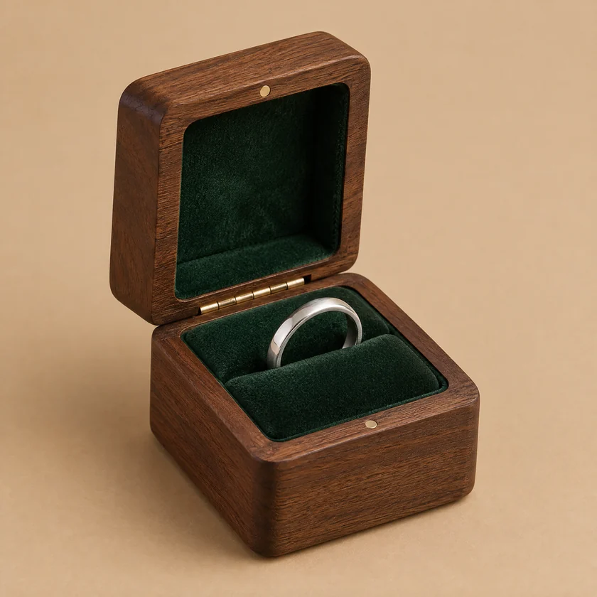 Unbranded walnut ring presentation box with an upright velvet ring insert