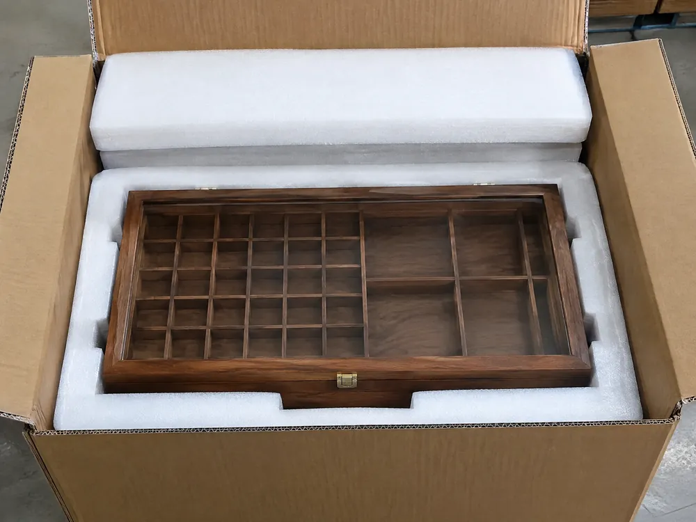 Unbranded mixed collection display case protected by fitted EPE foam in a corrugated carton