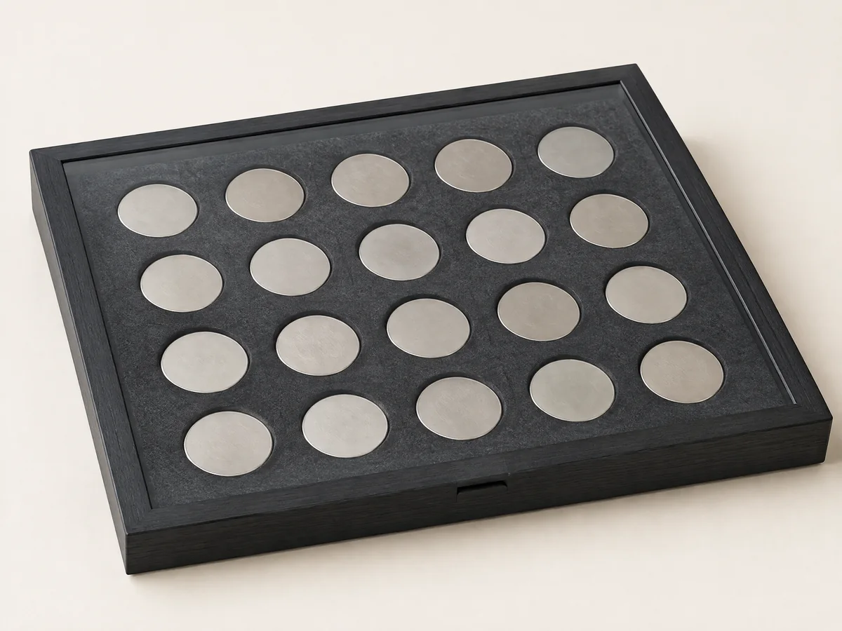 Low-reflection transparent panel over a multi-coin display