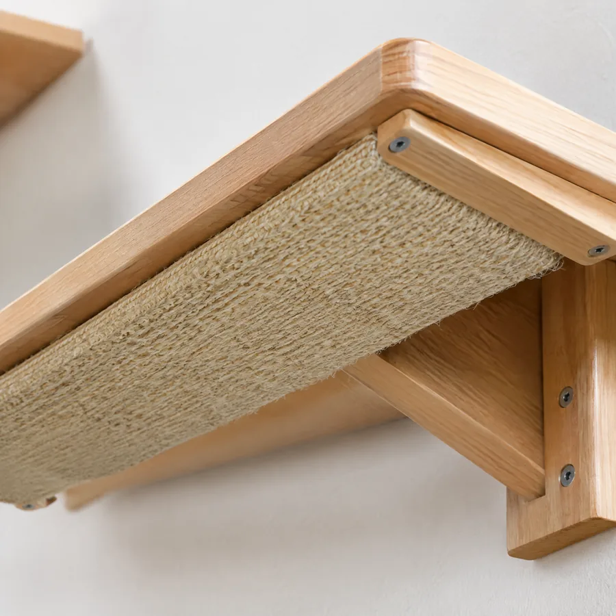 Unbranded replaceable natural sisal scratch panel under a wood shelf
