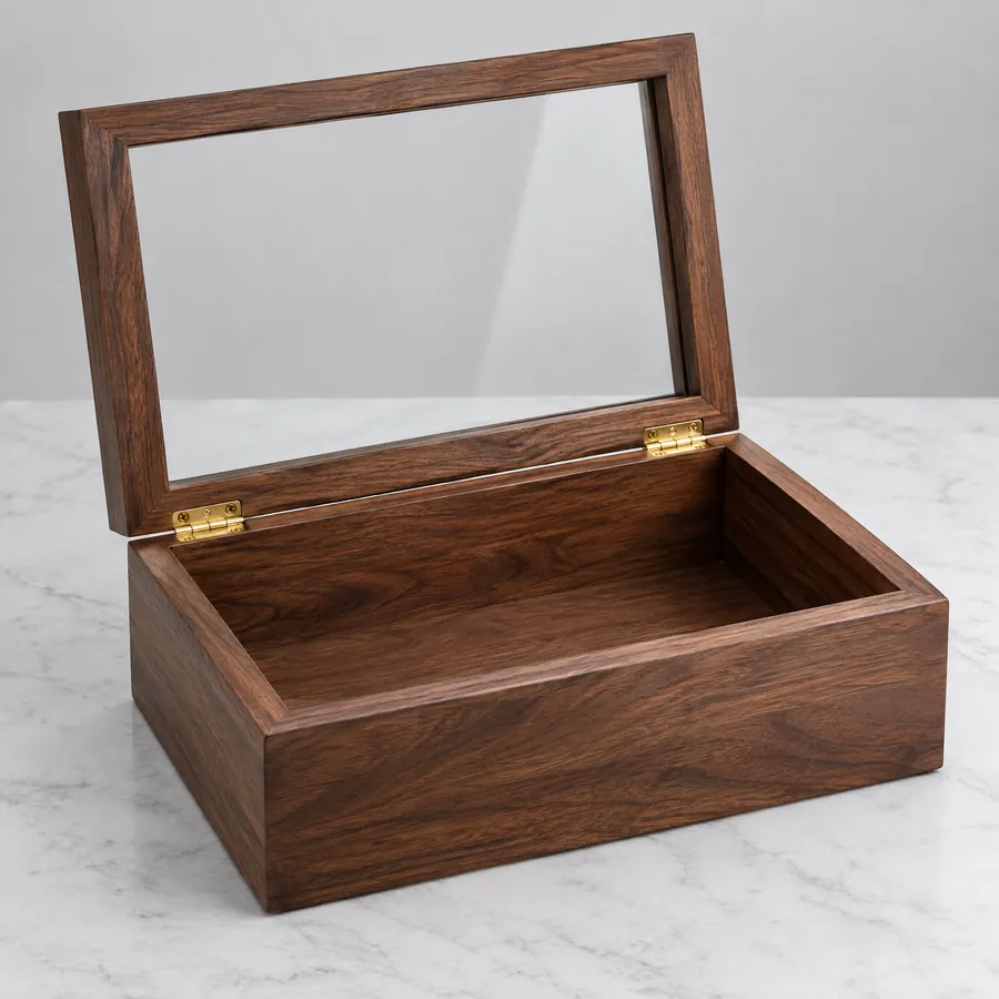 Clear glass viewing panel inset in an unbranded wooden box lid